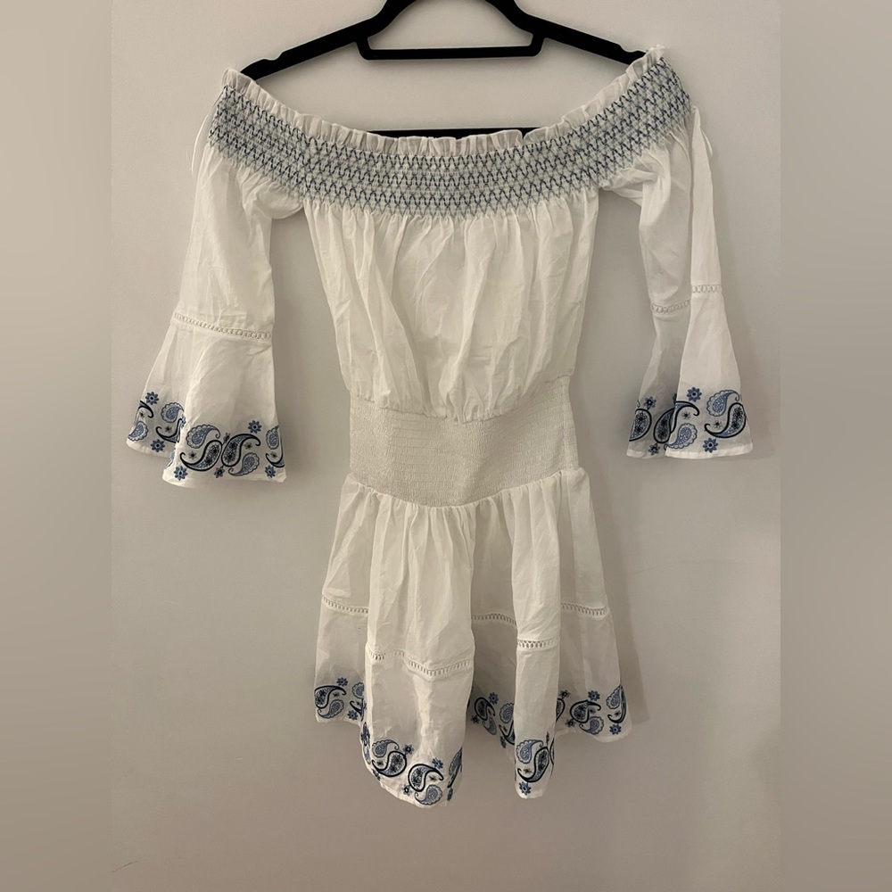 Subdued mini dress brand new! White with blue pattern.